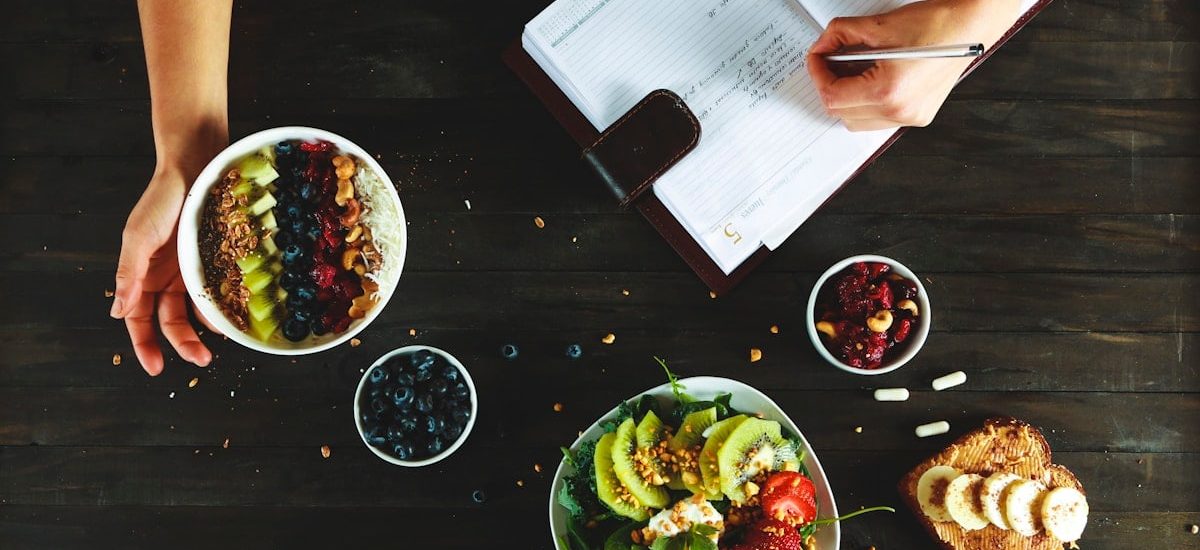 healthy food and notebook flat lay