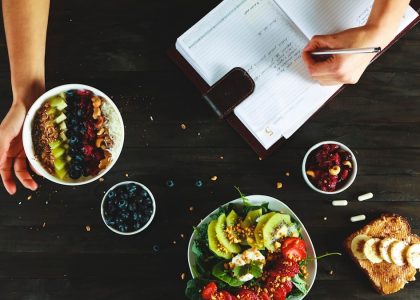 healthy food and notebook flat lay